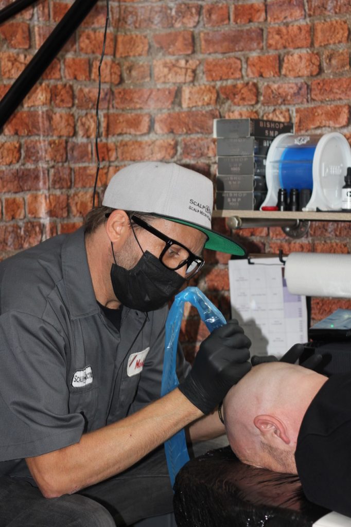 The Scalp Doctor® at work performing SMP on a client